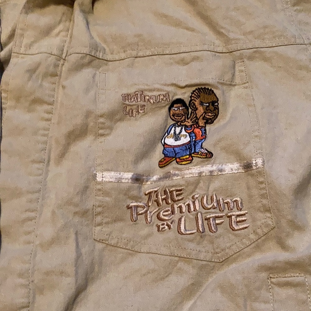 An XL hip hop history premium life tan short sleeve button up shirt